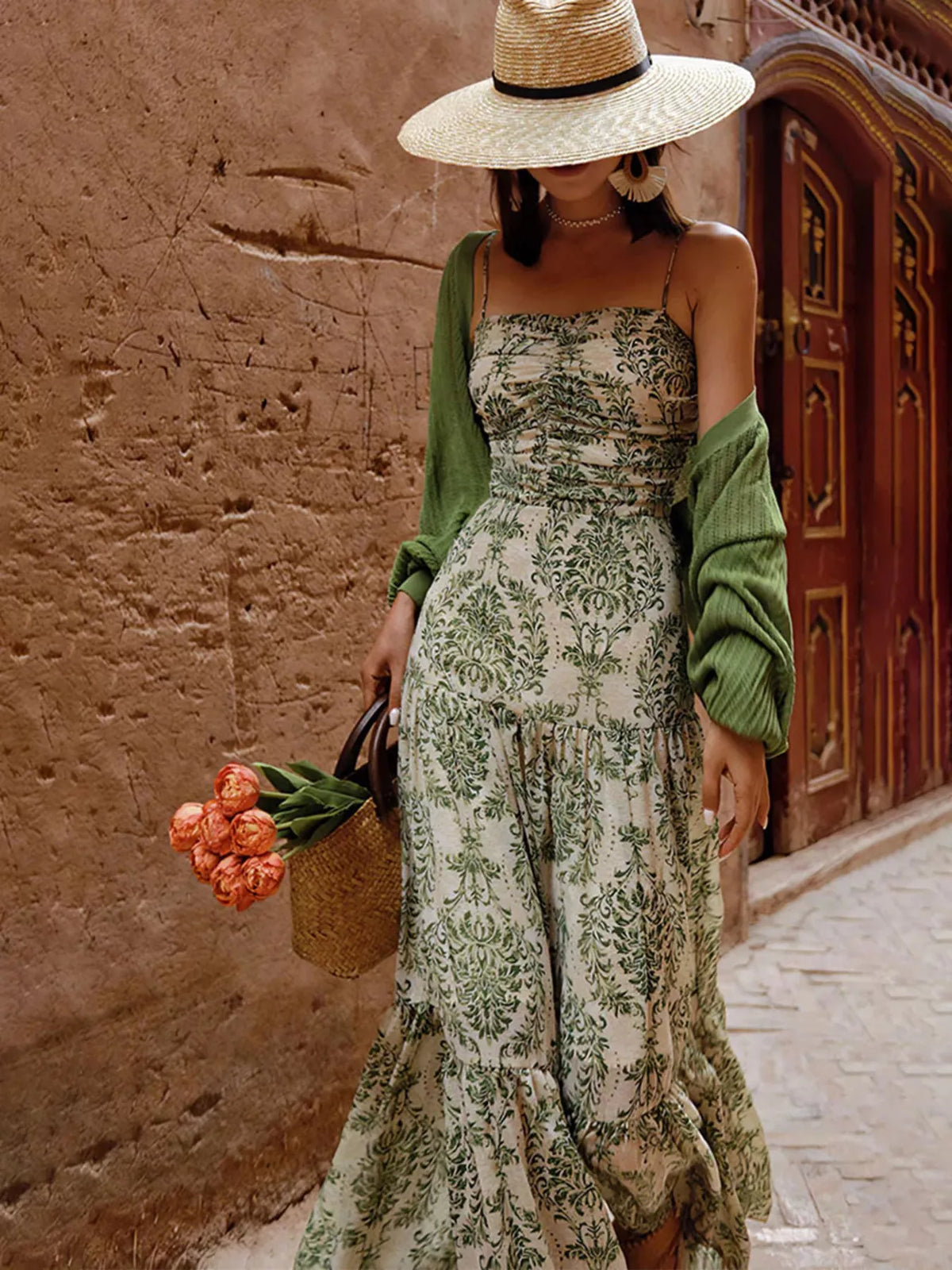 Sage green floral printed tiered maxi dress with spaghetti straps and gathered skirt