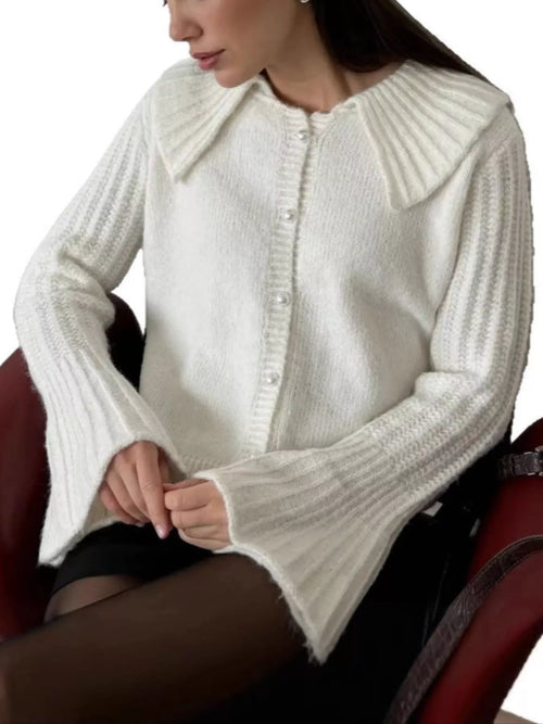 White ribbed cardigan with pointed collar, button front, and flared sleeves
