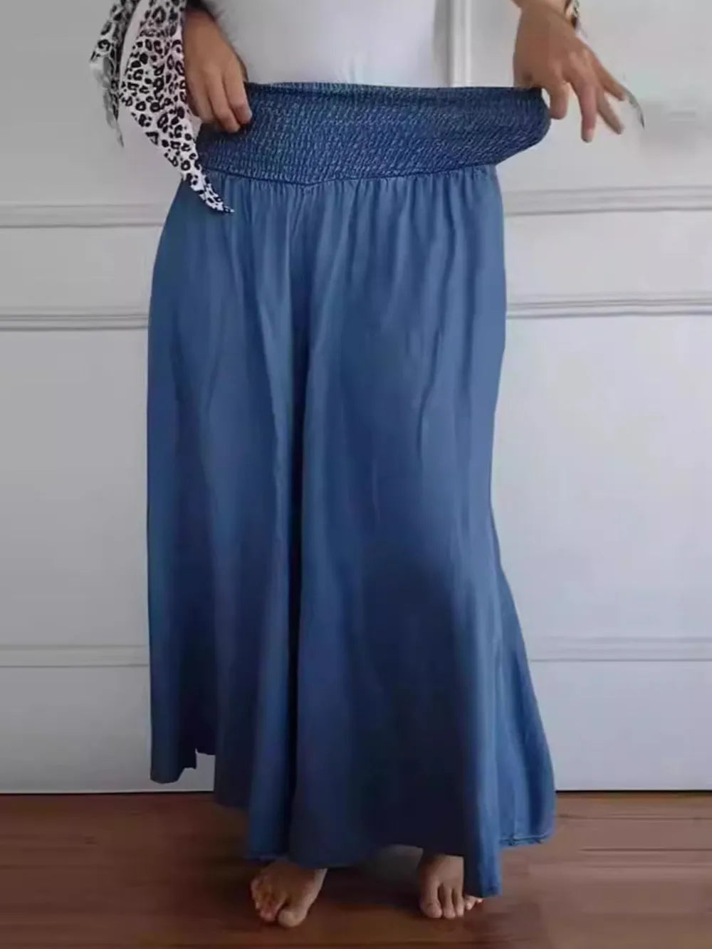 Dusty blue smocked waist wide-leg pants with full skirt and soft folds