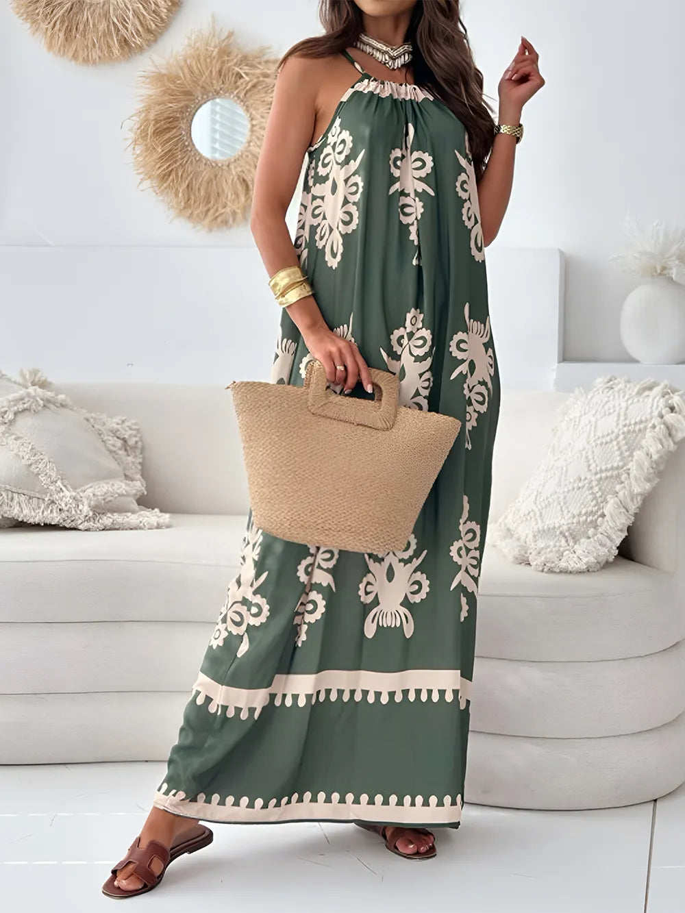 Green printed maxi dress with spaghetti straps, ruffled neckline, and cream floral border trim