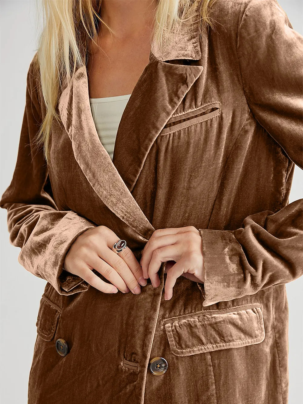 Camel corduroy blazer close-up with notch lapel and front buttoned pockets