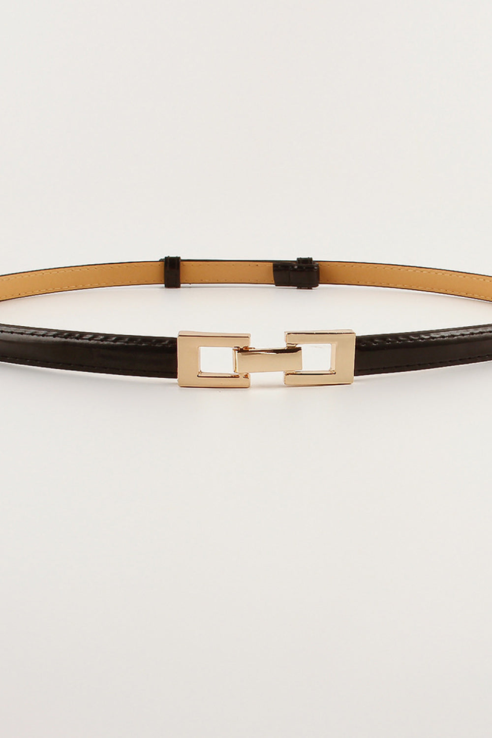 Tan slim belt with dark-brown backing and gold-tone square buckle