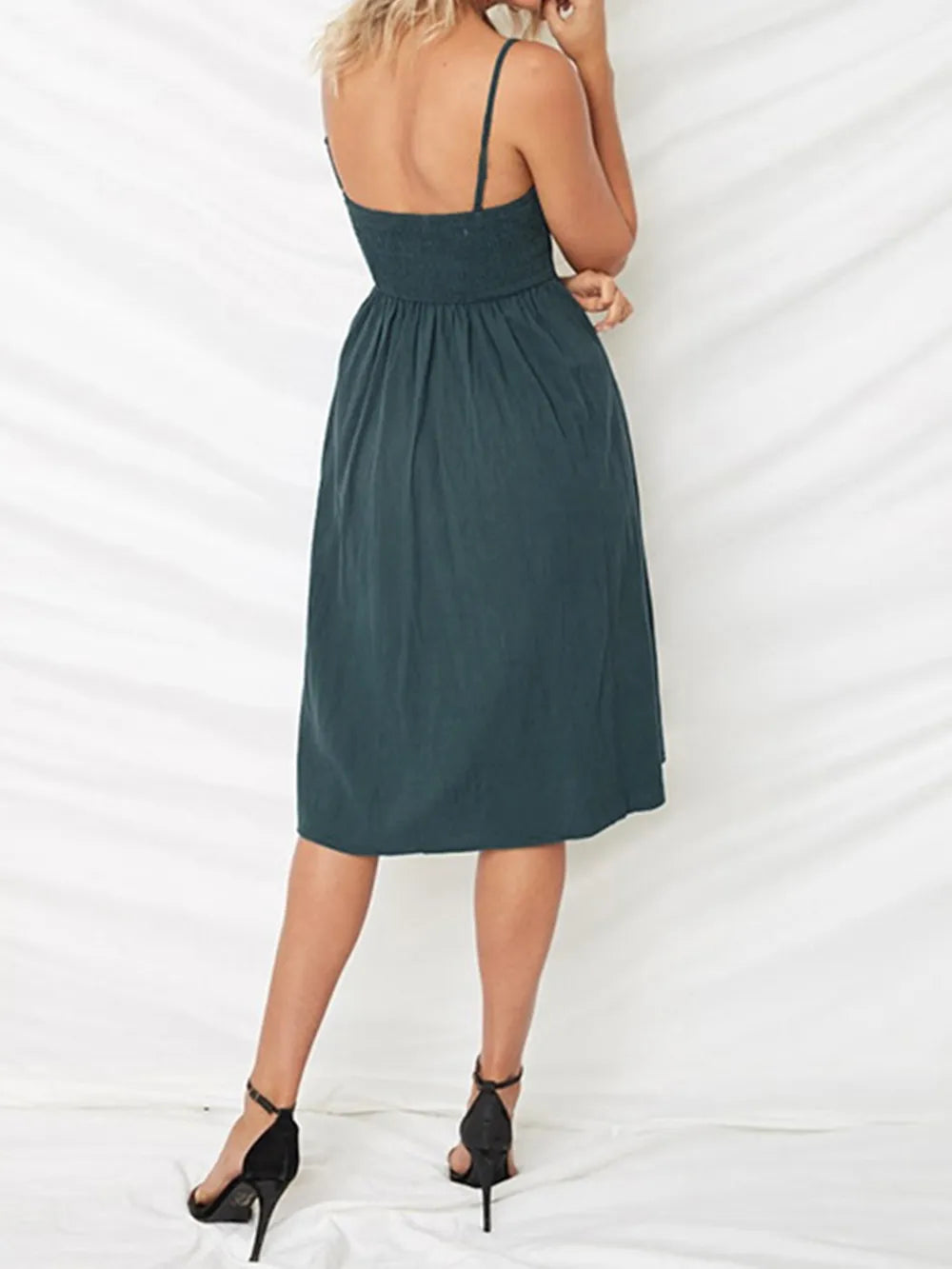Dark teal cami dress back view with slim straps and open back neckline