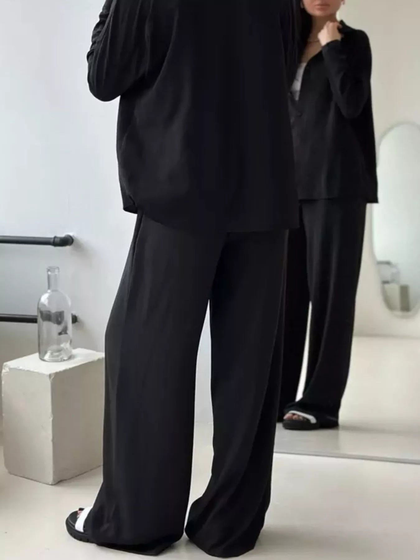 Black relaxed-fit shirt and wide-leg pants set, loose shirt over flowing wide-leg pants