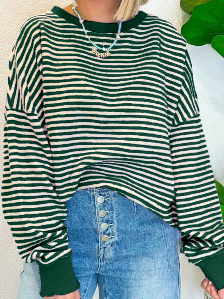 Green-and-white striped long-sleeve sweatshirt with round neck and relaxed hem