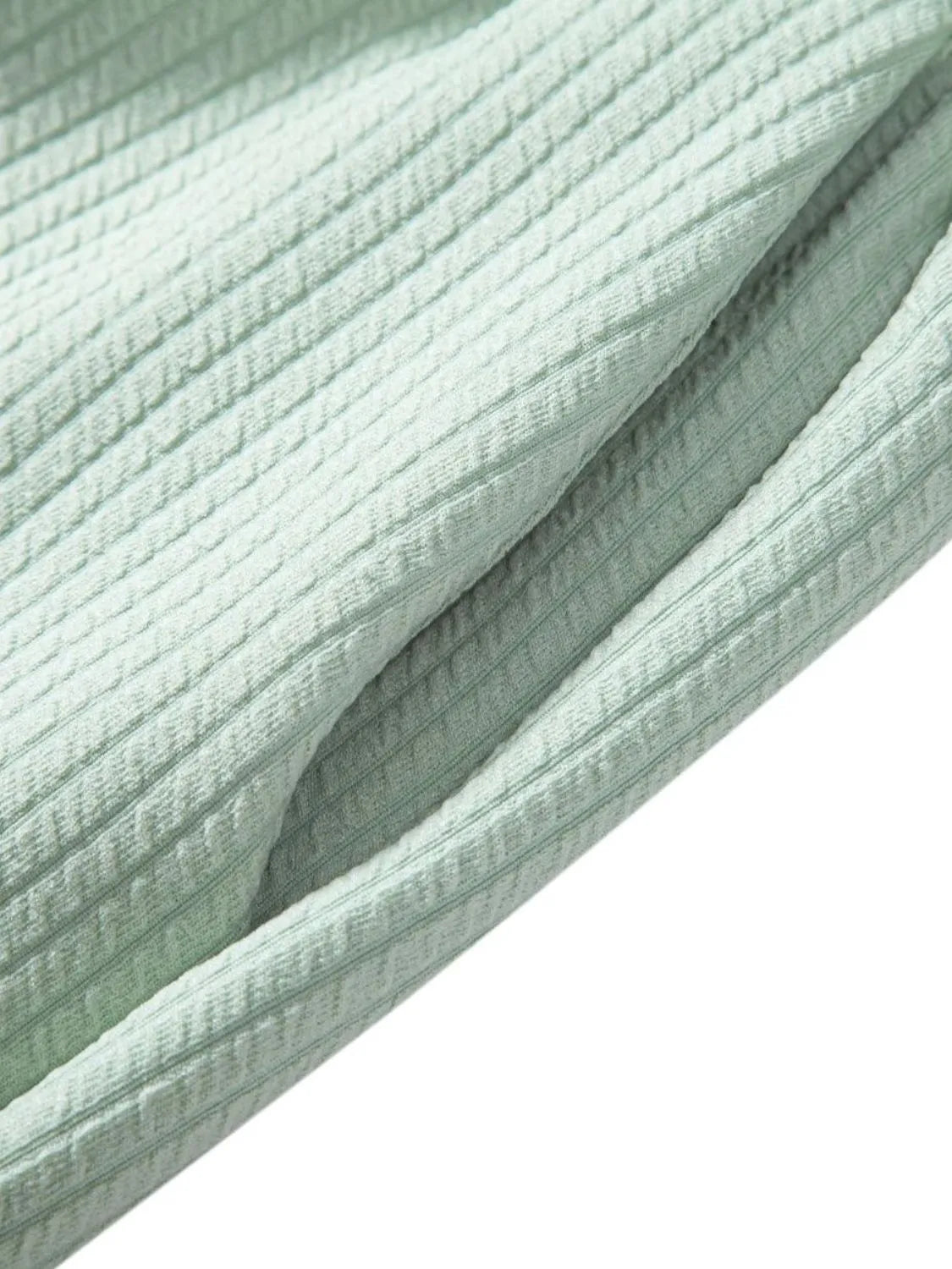 Mint green ribbed fabric with stitched side seam