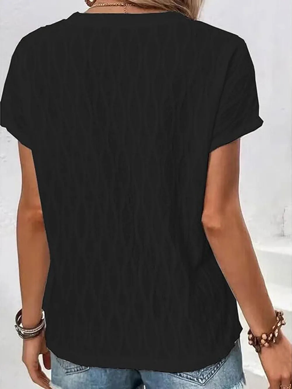 Round-neck short-sleeve T-shirt in black, back view with crew neckline