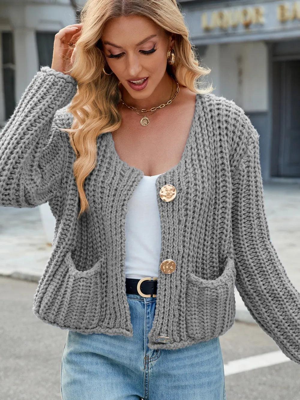 Gray chunky knit round-neck button cardigan with front patch pockets