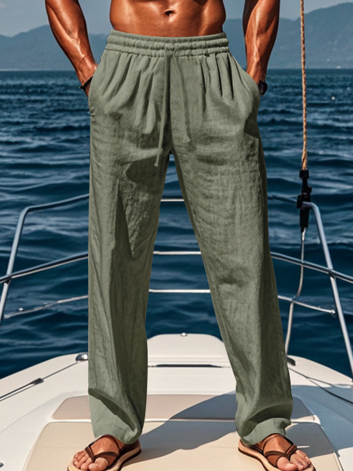 Loose-fit gray green drawstring pants with elastic waistband and tapered cuffs