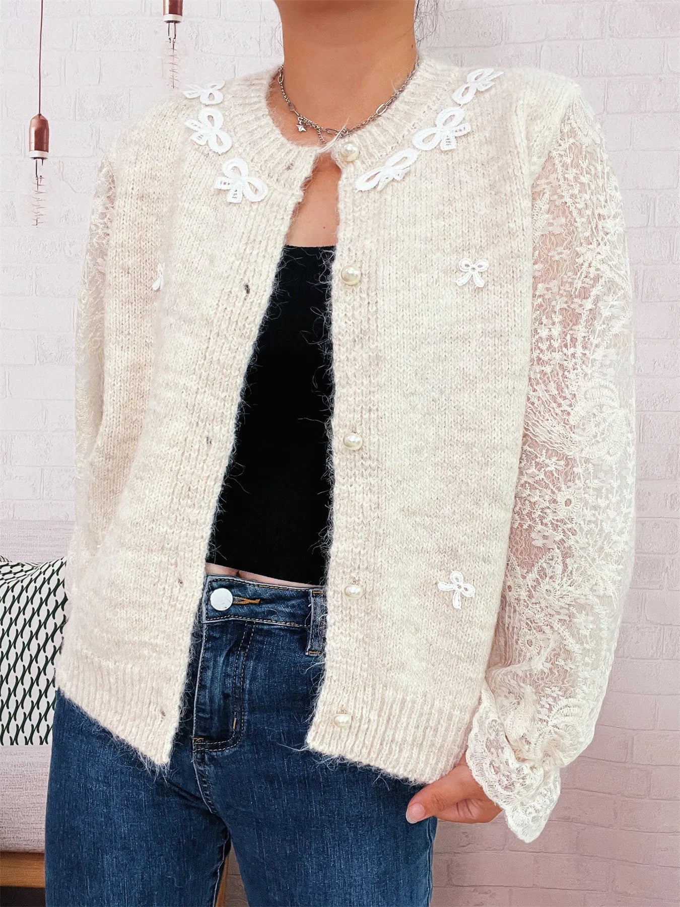 Cream lace-sleeve button-up cardigan with scalloped flower trim on collar and buttons