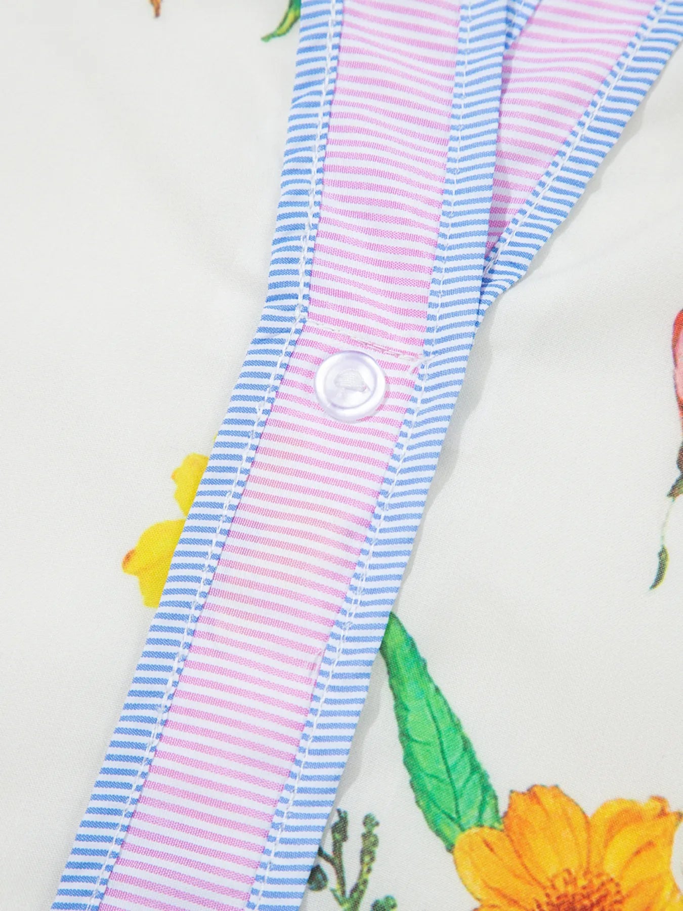 Floral print notched short sleeve dress by Trendsi with blue and pink striped trim and a white button