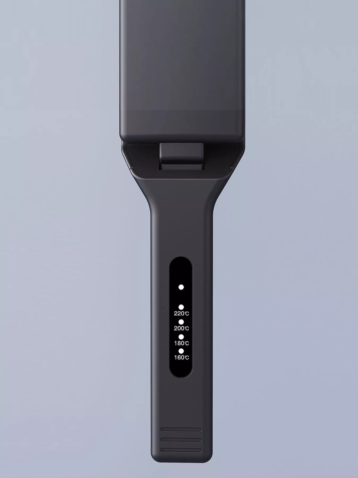 Black straightener handle close-up with 180°C and 220°C temperature display