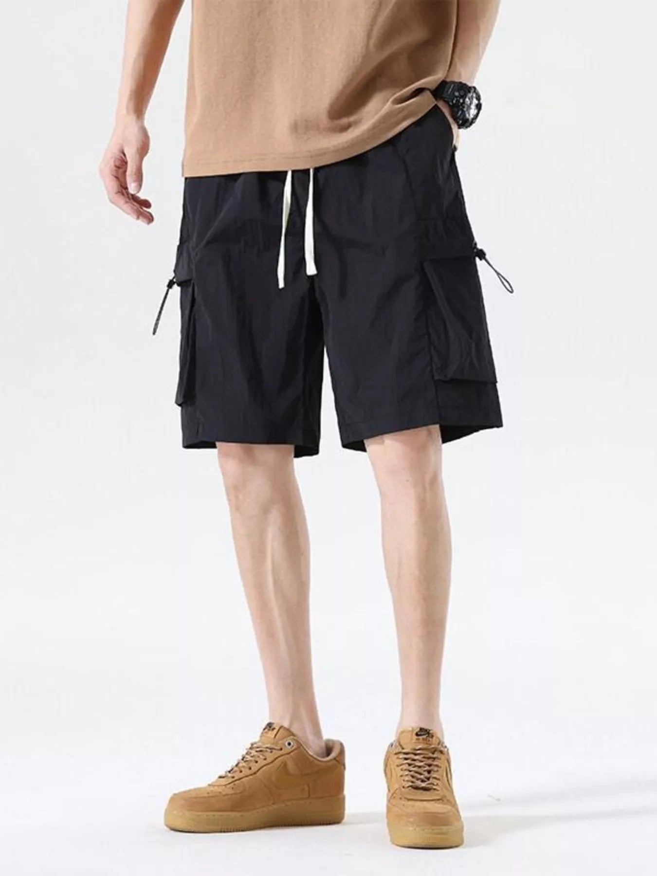 Black cargo shorts with drawcord waist and multiple side pockets