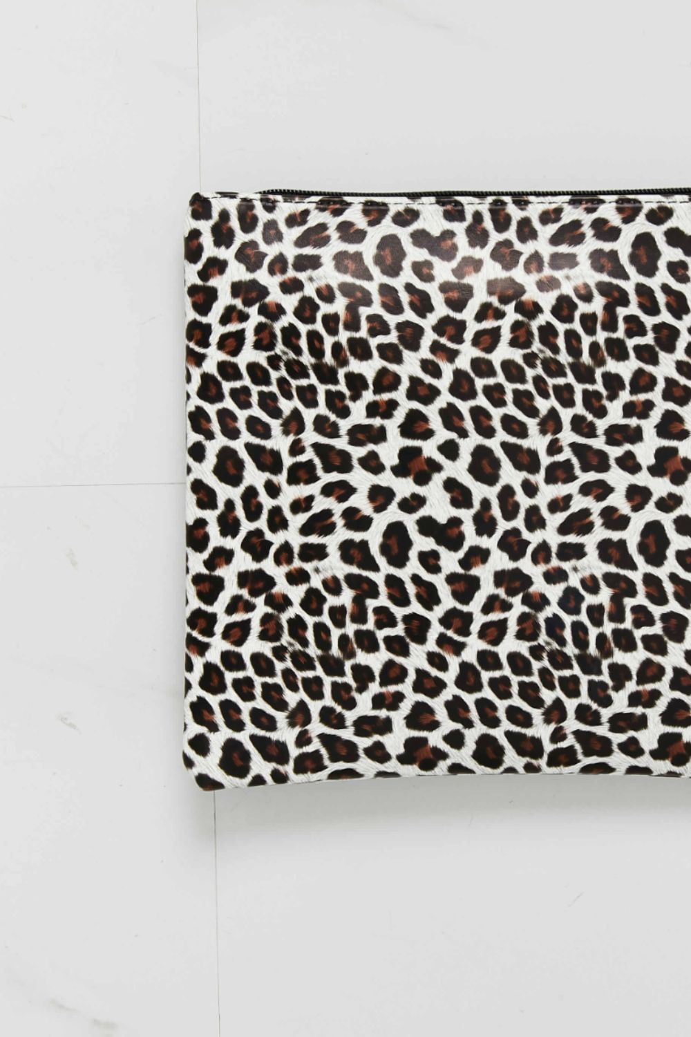 Leopard print wristlet pouch, front view close-up of fabric