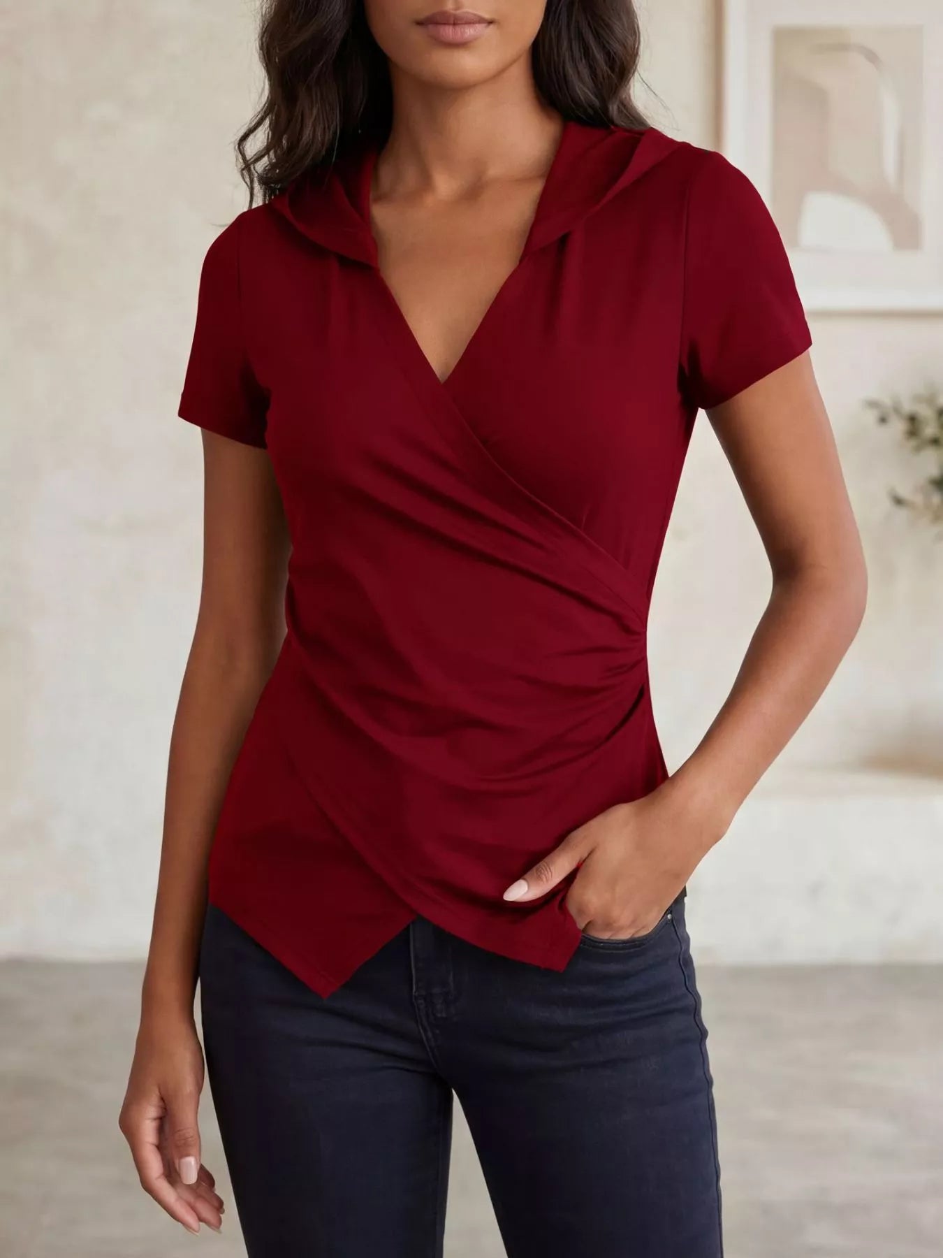 Red hooded wrap-front slim fit top with short sleeves and V neckline drape