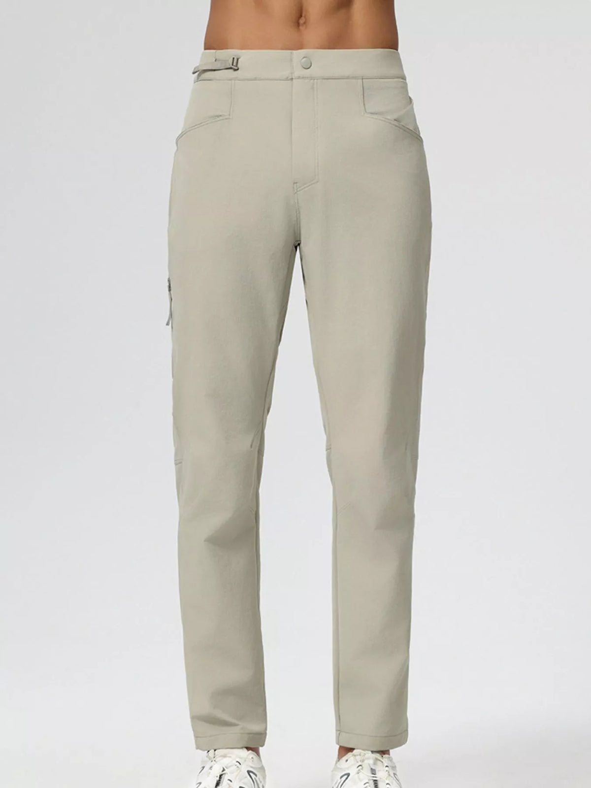 Men's slim-fit stretch casual pants in khaki, back view with tapered legs