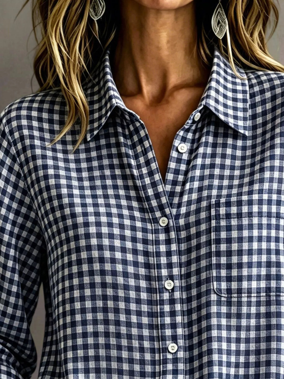 Navy-and-white gingham long-sleeve button-down shirt with chest pocket and button front.