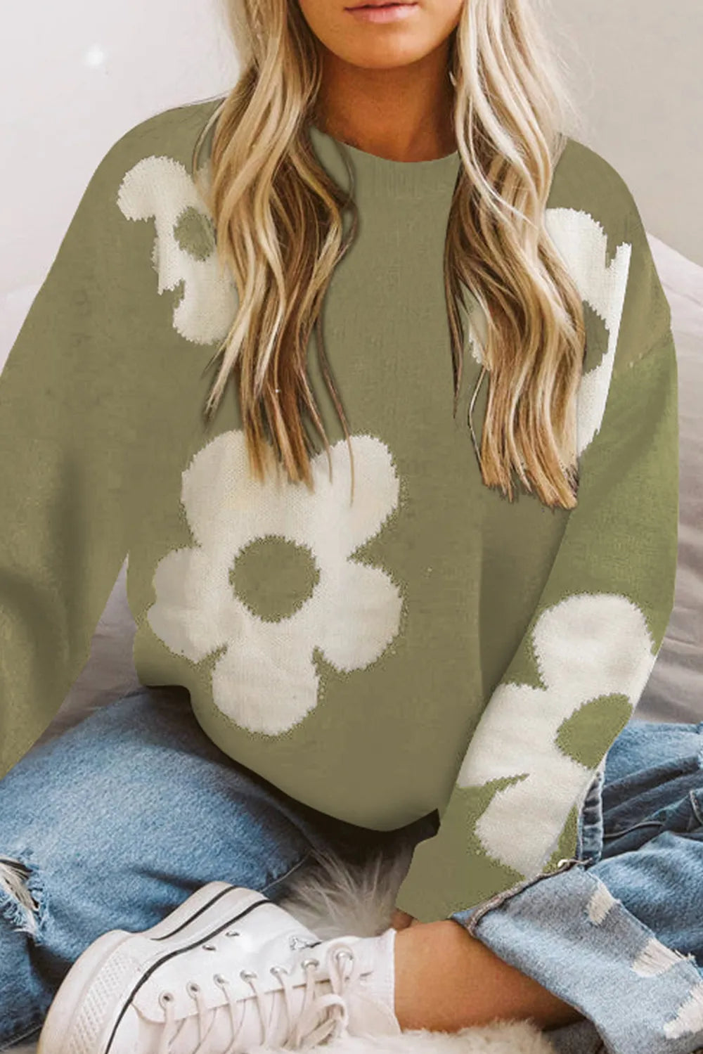 Olive green long-sleeve sweater with white floral pattern and round neckline