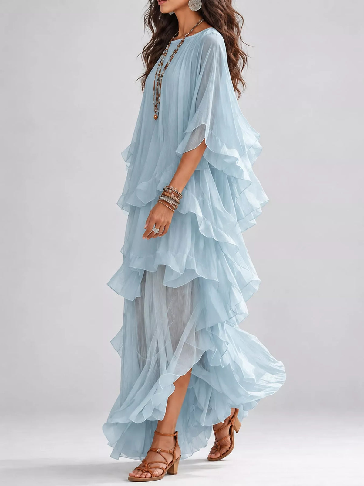 Sky blue tiered maxi dress with cascading ruffle layers and draped sleeve