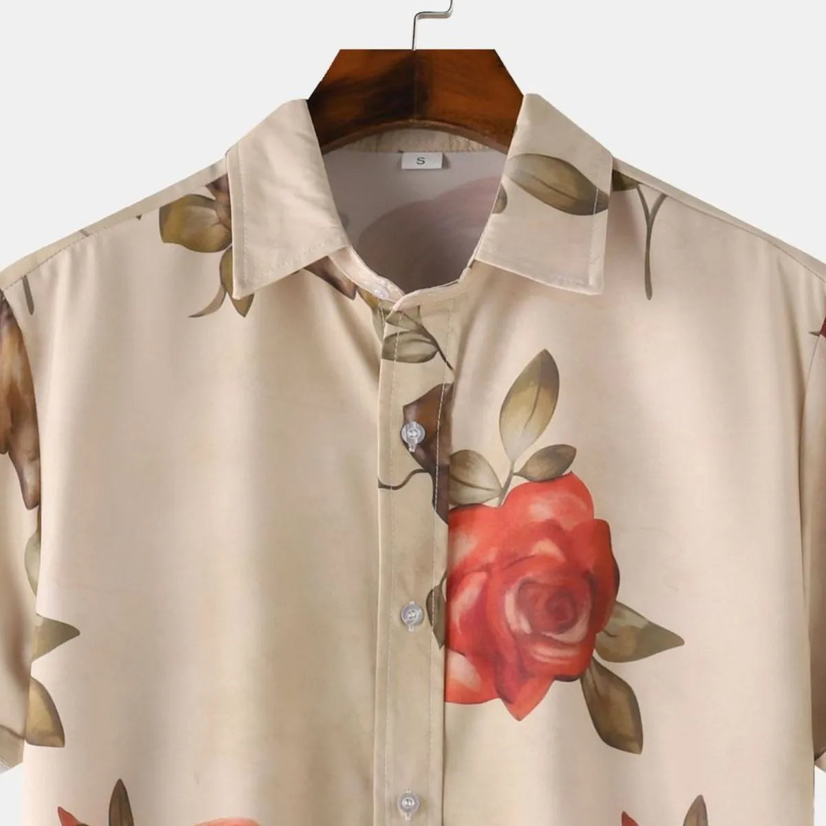 Front close-up rose print short-sleeve button-down shirt, tan with red rose near buttons