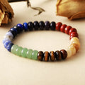 Multicolor natural stone bead bracelet with blue, green, red, black, and cream beads
