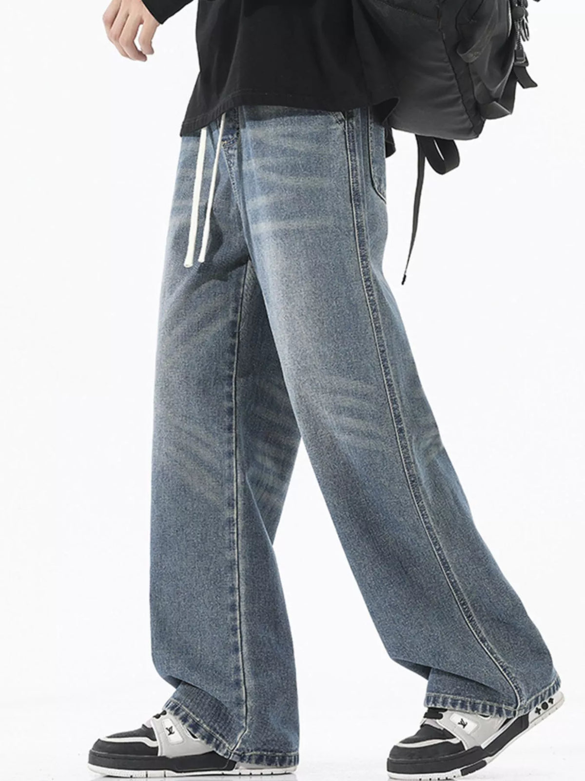 Men's vintage blue wide-leg jeans with white drawstring waist and slanted side seams