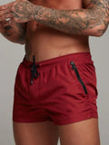 Men's active shorts in deep red with drawstring ties and side pockets