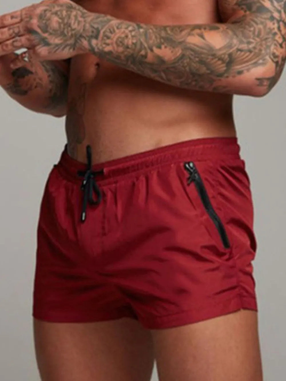 Men's active shorts in deep red with drawstring ties and side pockets