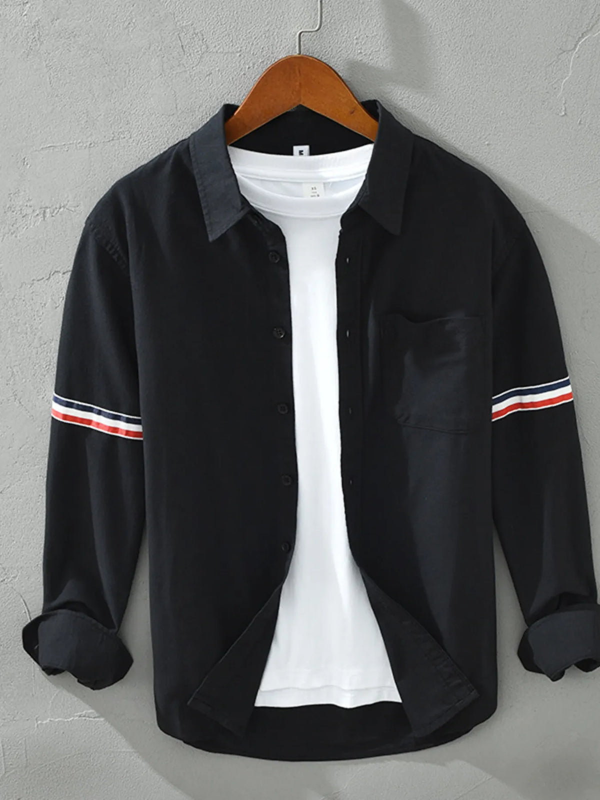 Men's classic long sleeve button-up shirt in black, chest pocket with striped sleeve band