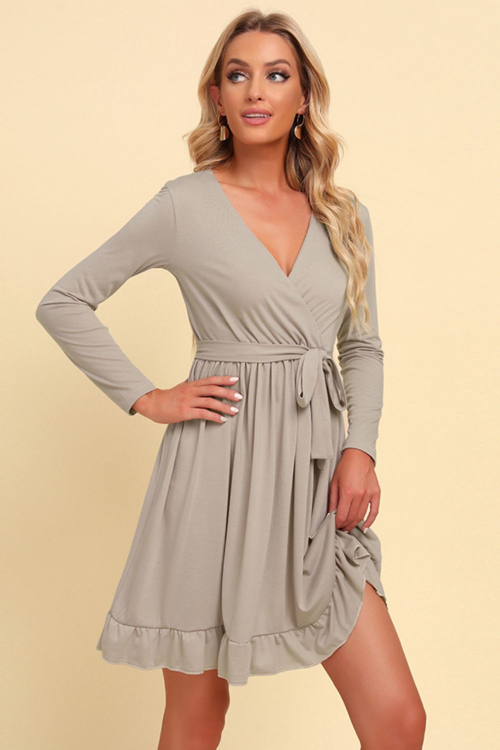 Long sleeve tie-waist ruffle hem dress, light gray front view with V-neck