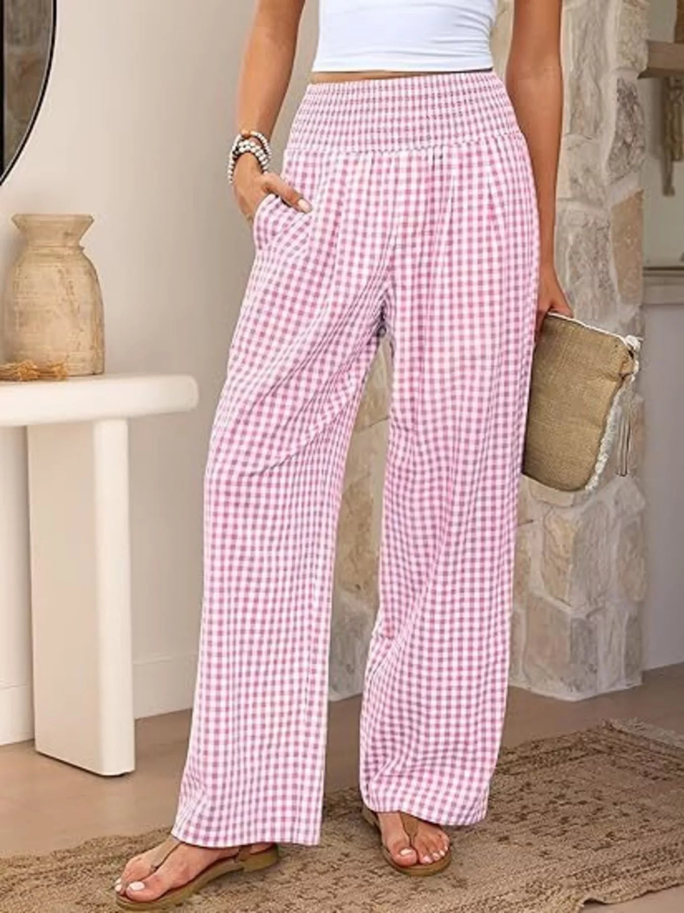 Pink and white gingham wide-leg pants with smocked waist and side pockets