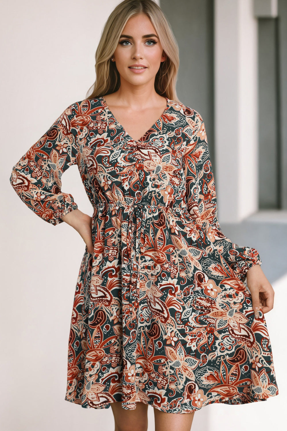 V-neck mini dress with long sleeves and gathered waist, paisley multicolor print