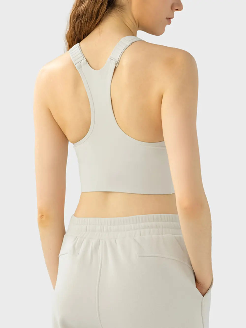 Ivory sport bra back view with wide straps and racerback design