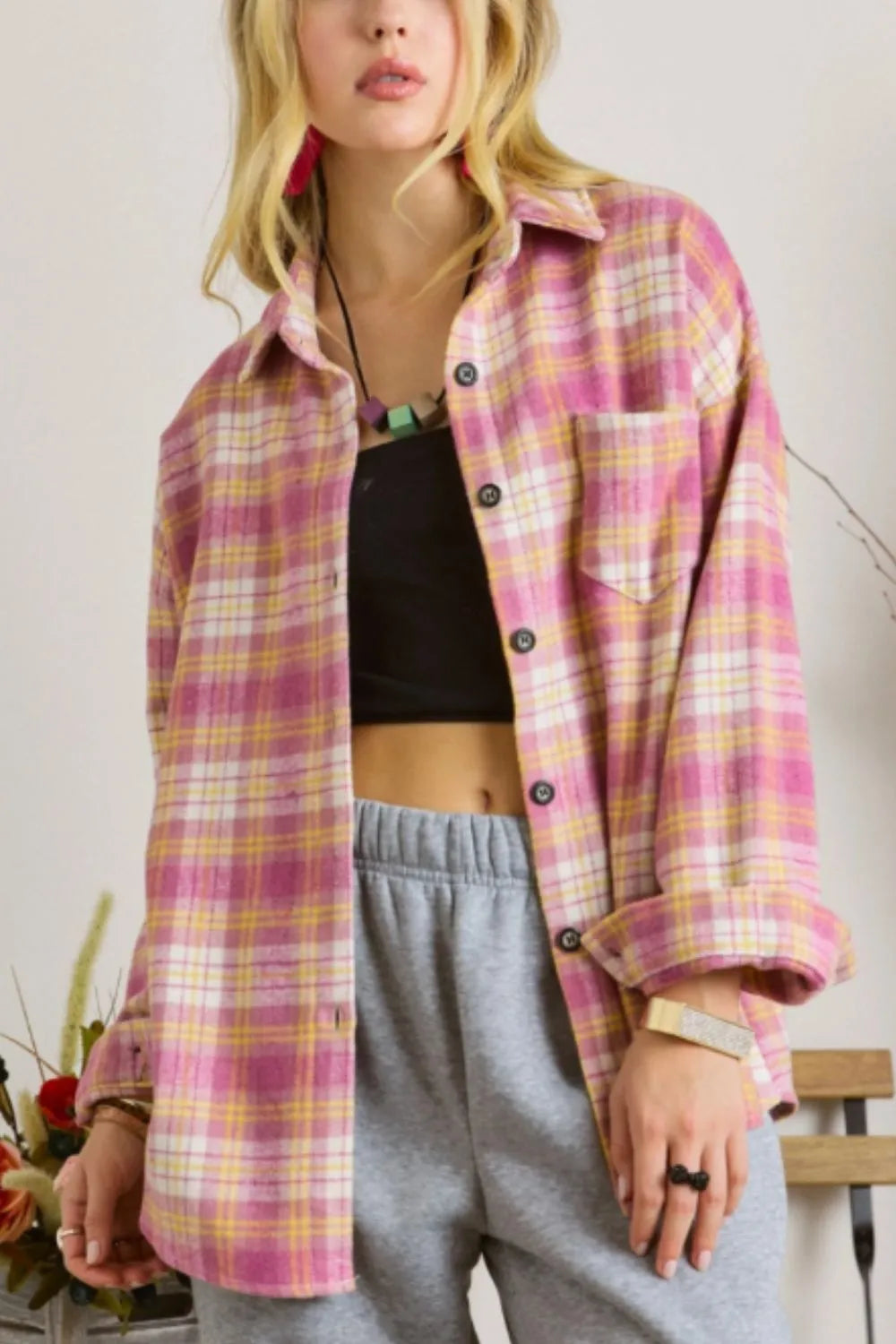 Pink plaid collared button-up shacket with front buttons and chest pocket