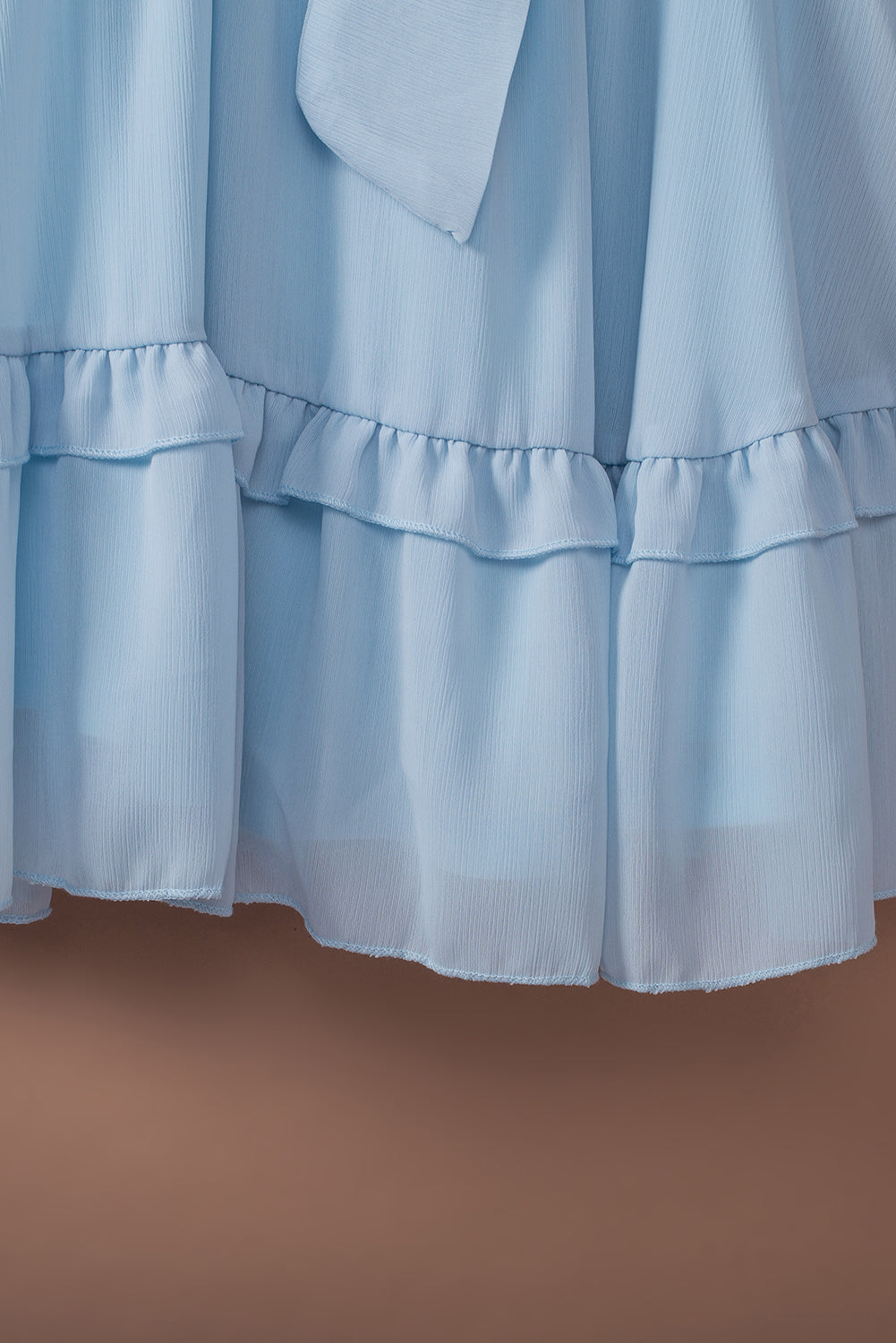 Sky blue tiered ruffle skirt hem detail with smocked waist on flounce dress