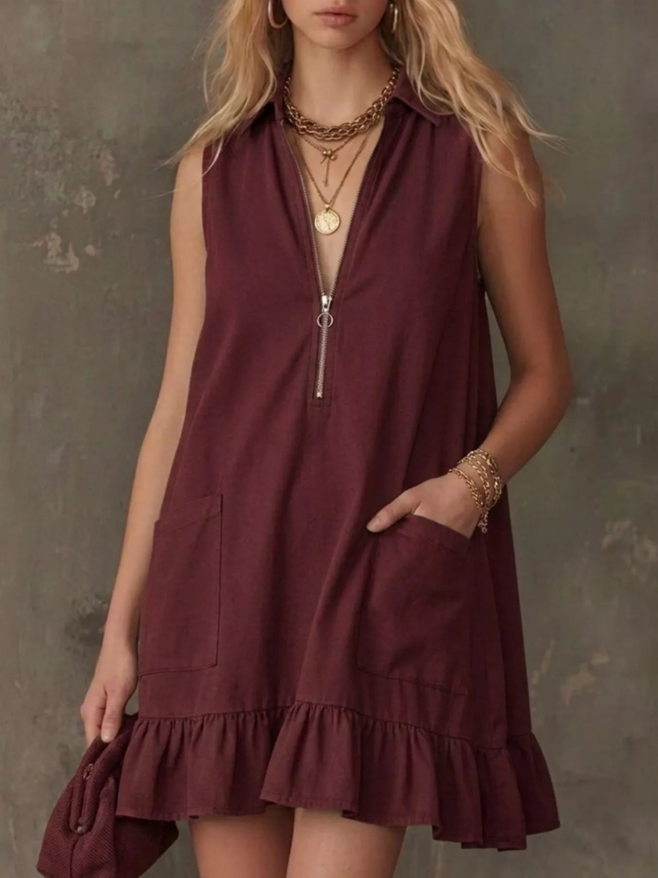 Burgundy sleeveless collared zip-front ruffle hem dress with front zip and pockets