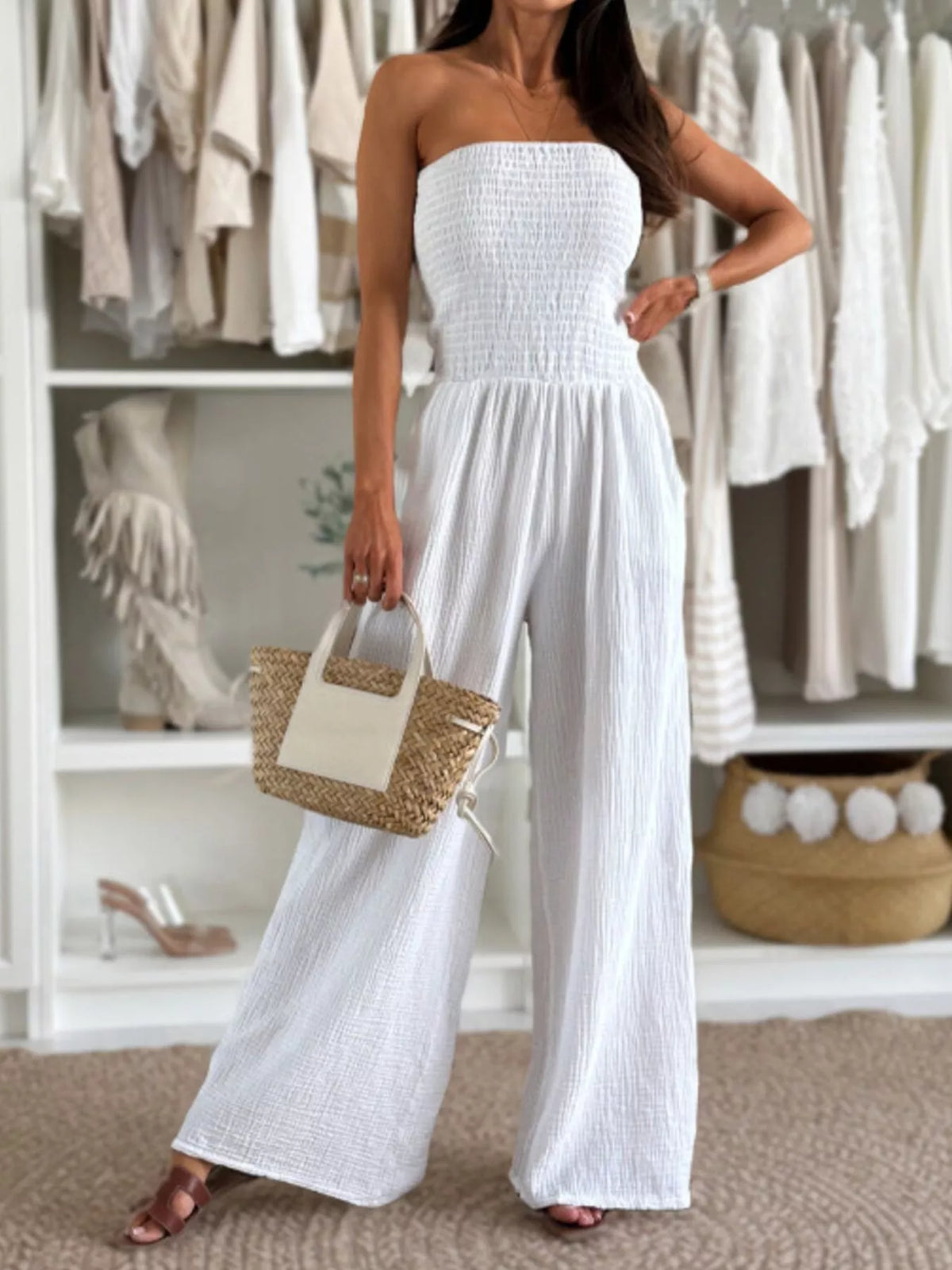 White strapless smocked wide-leg cotton jumpsuit with pleated waist and wide pant legs