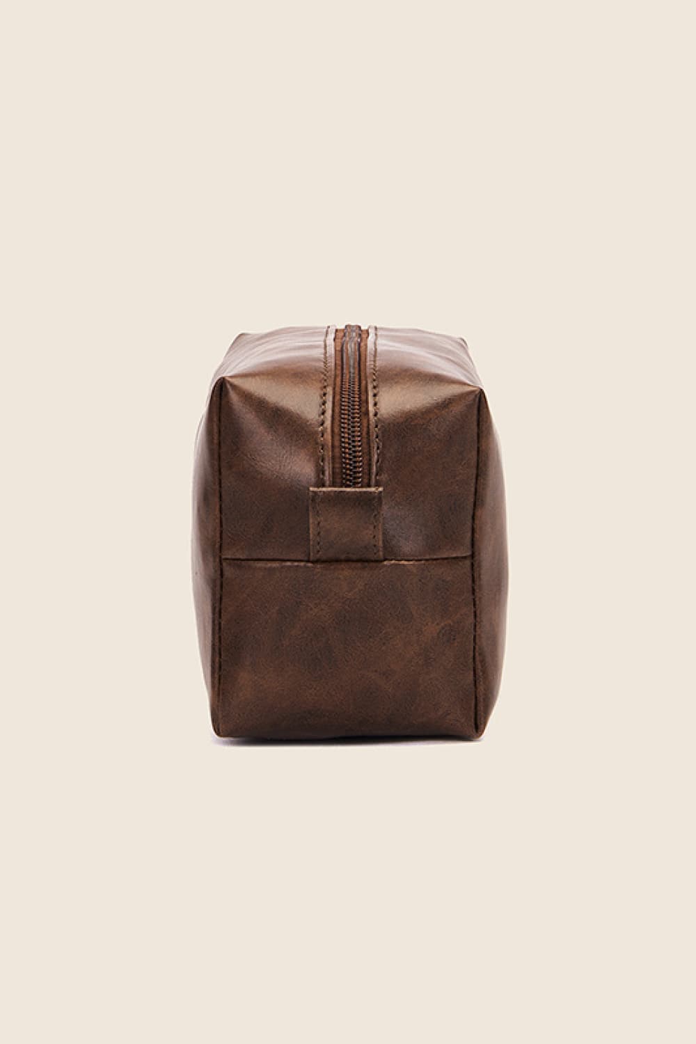 Brown vegan leather makeup bag with top zipper and small front seam panel