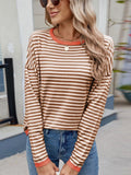 Caramel and white striped round-neck long-sleeve sweater with orange contrast trim