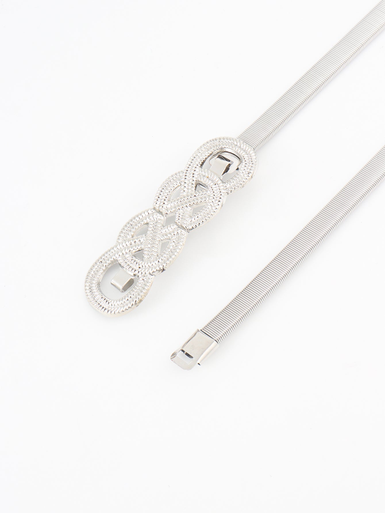 Silver metal belt with knot buckle detail and ribbed strap, isolated
