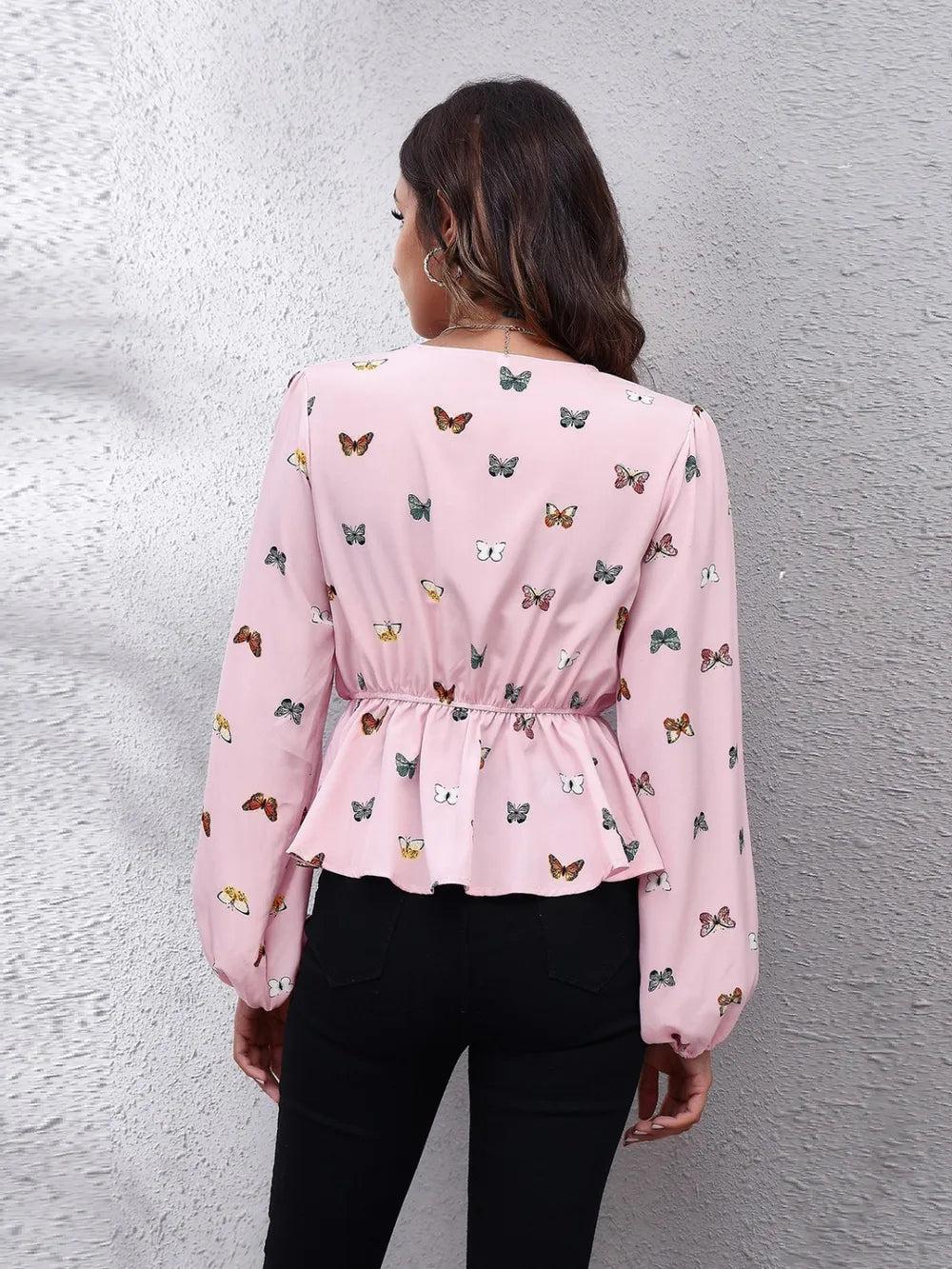Blush pink butterfly print peplum blouse, long balloon sleeves (back view)