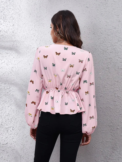 Blush pink butterfly print peplum blouse, long balloon sleeves (back view)