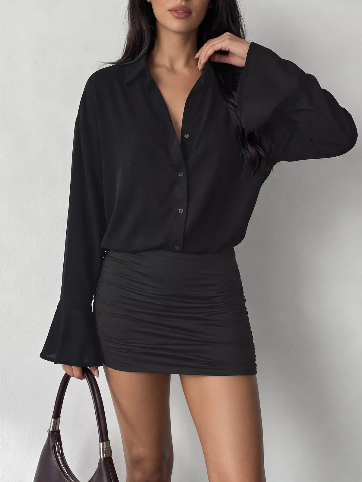 Black button-front shirt dress with ruched mini skirt and flared cuff sleeves