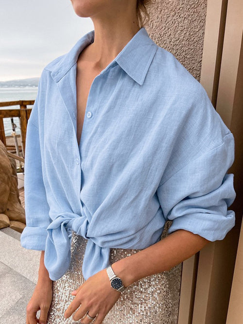 Light blue button-up long-sleeve shirt with collar and button placket
