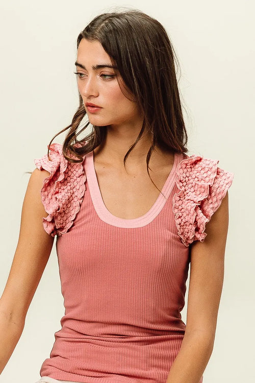 Dusty rose rib knit sleeveless top with textured ruffled shoulder details