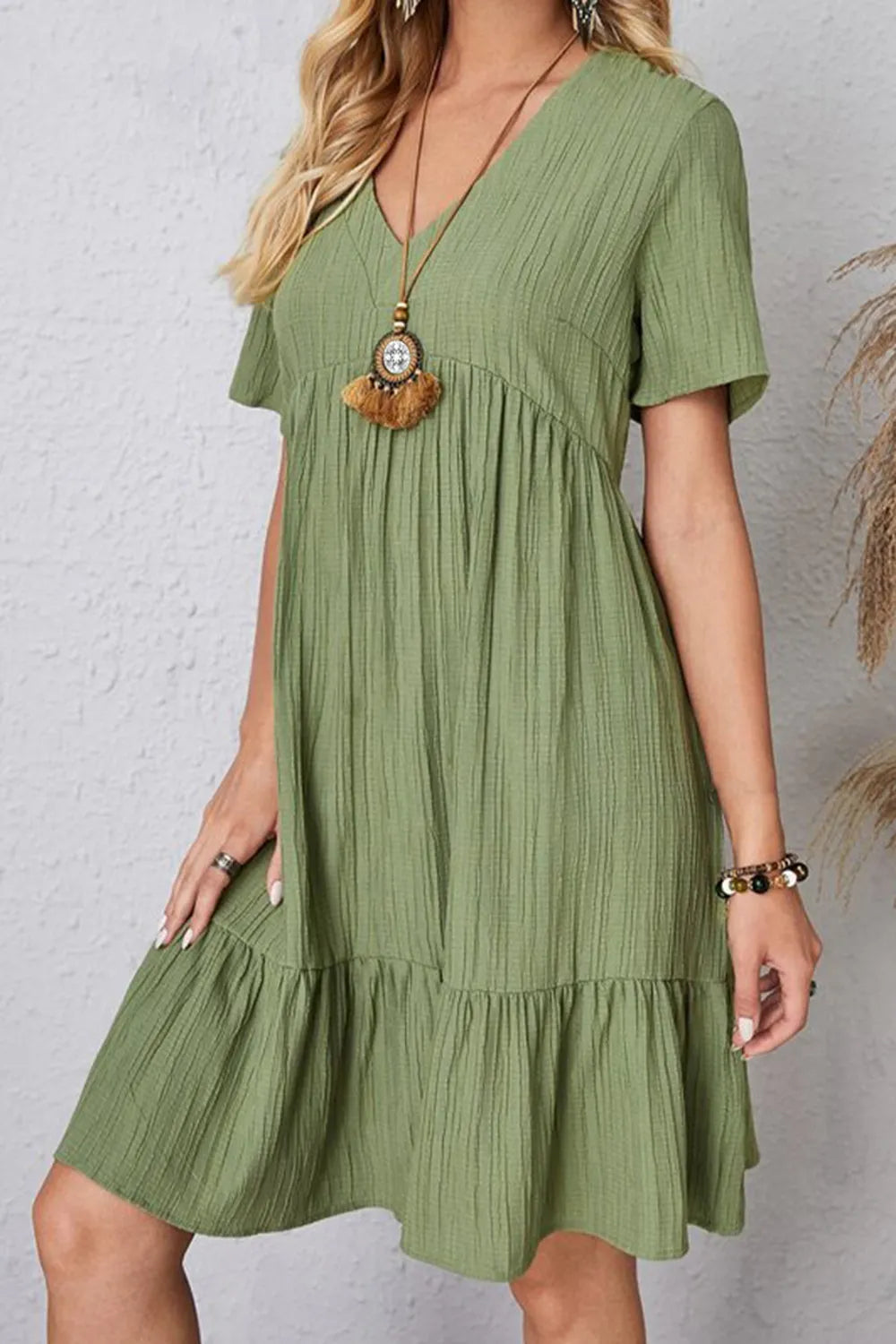 Olive V-neck short-sleeve dress with gathered bodice and tiered skirt