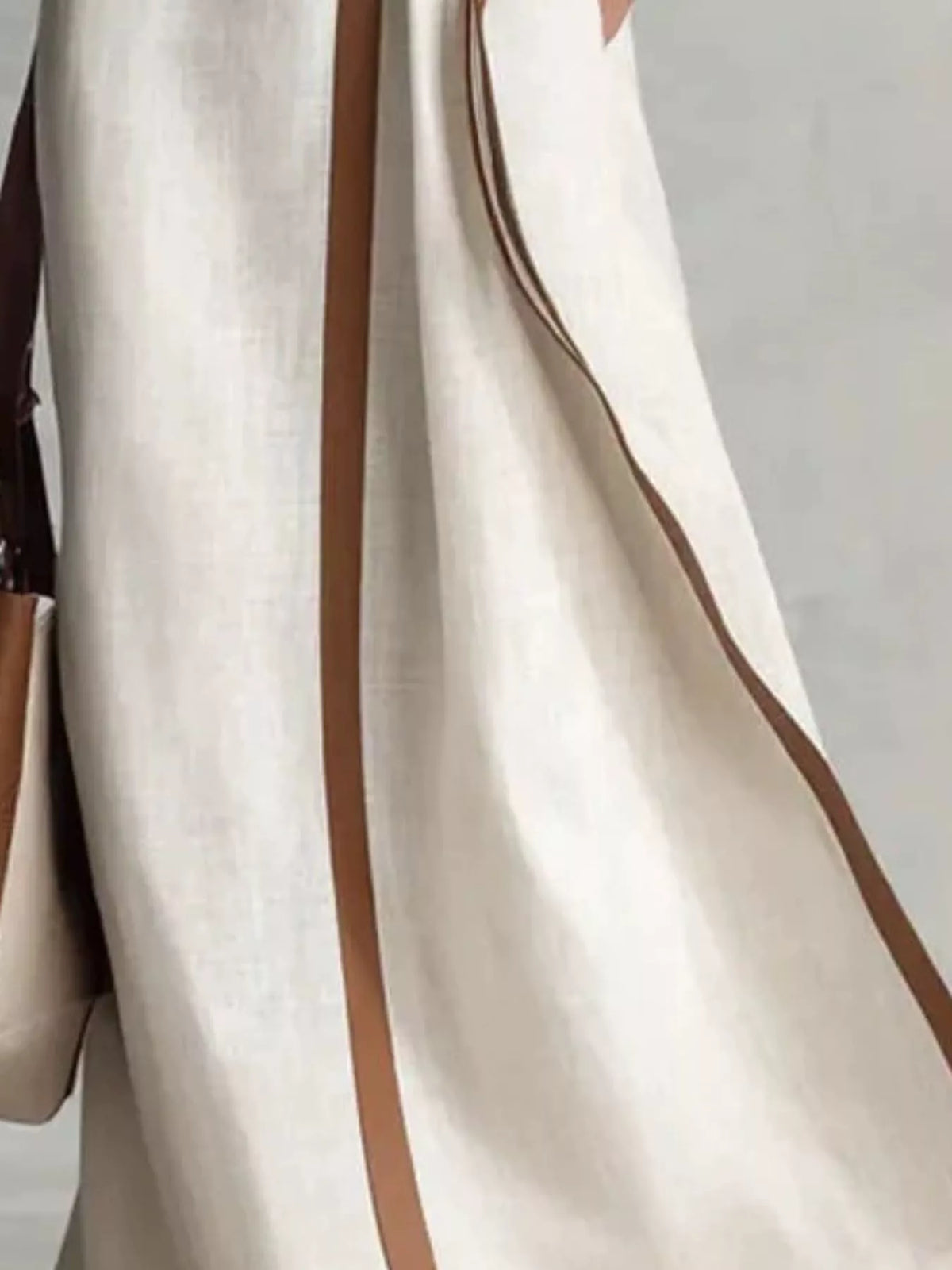 White belted wrap maxi dress with contrast trim seam detail and draped side panels