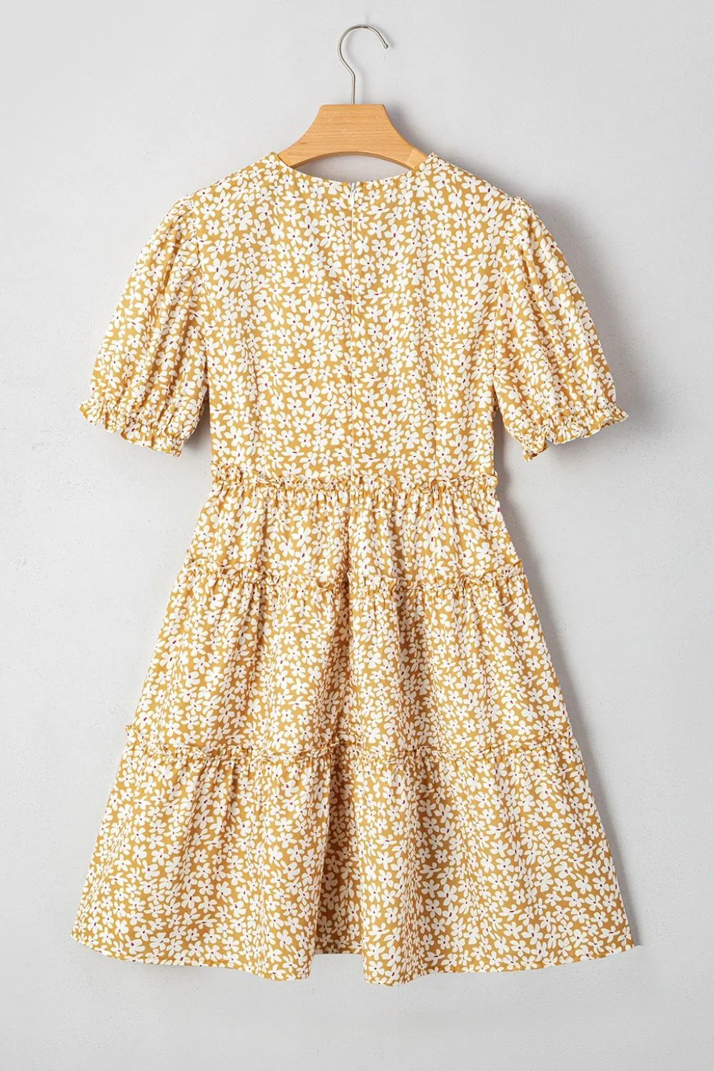 Floral short-sleeve surplice frilly tiered mini dress by Trendsi in mustard yellow with white flowers