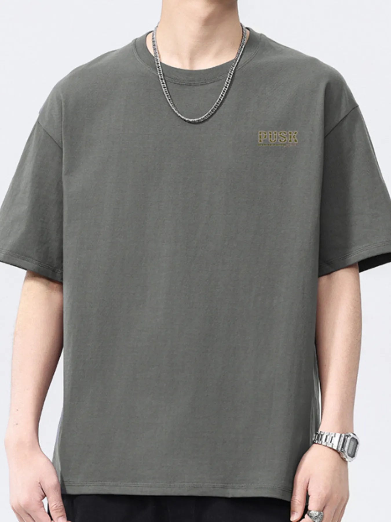 Dark gray men's short-sleeve crewneck T-shirt with small chest logo.
