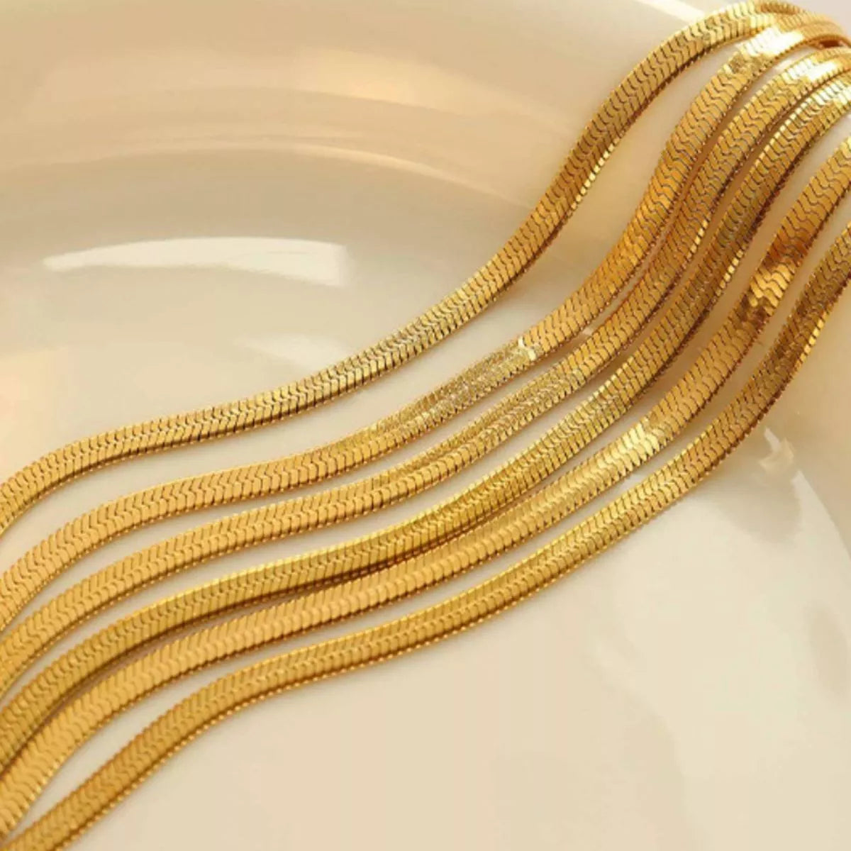 Gold-plated layered chain necklace with multiple slim strands